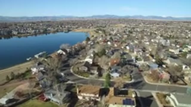 WESTMINSTER COLORADO-2016: Aerial View Of A City Near A Lake Landscape With Mountains And Sky