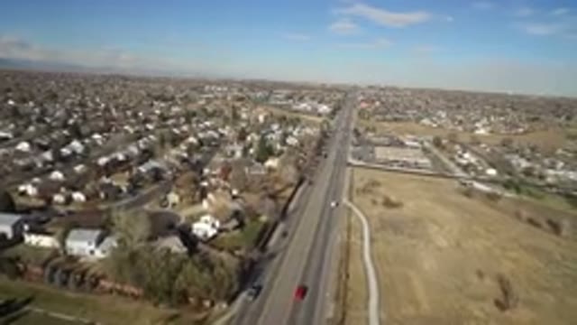 HIDDEN LAKE COLORADO-2016: Aerial View Of A Busy Four Lane Road Cutting Through