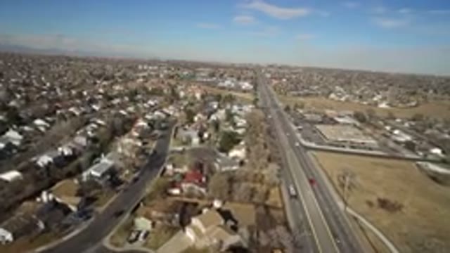 HIDDEN LAKE COLORADO-2016: Large Houses Close Together Near A Motor Highway