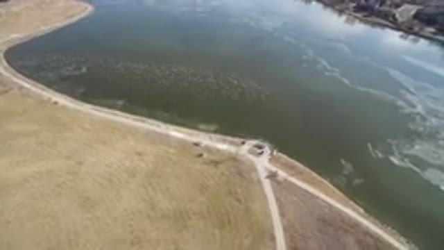 HIDDEN LAKE COLORADO-2016: Aerial Image Of A Long Road Along A River With Stream