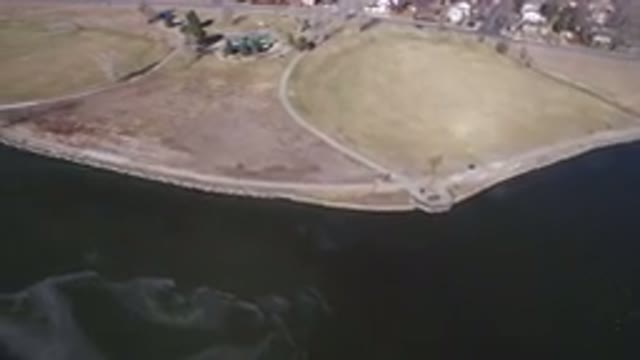 HIDDEN LAKE COLORADO-2016: Flying Shot Of A Road And Some Houses By The Coast