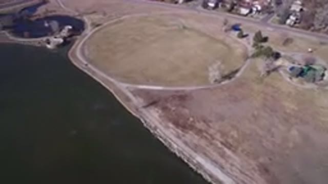 HIDDEN LAKE COLORADO-2016: Aerial View Of A Green Field With Streets Houses And