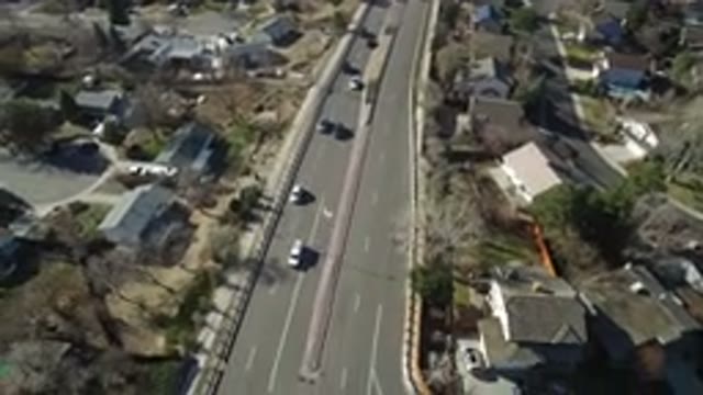 HIDDEN LAKE COLORADO-2016: Aerial View Of Cars Moving On The Road Through A City
