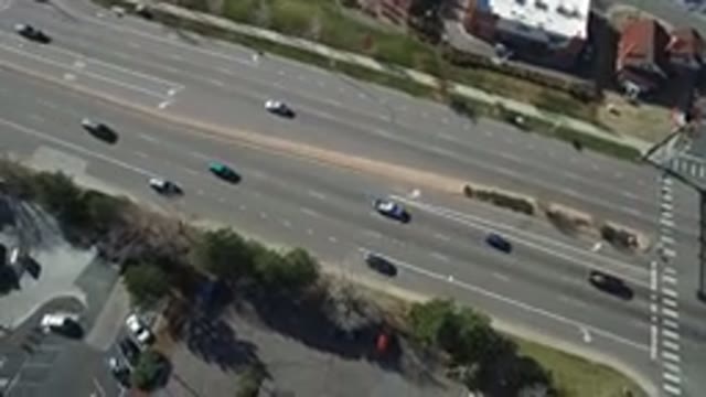HIDDEN LAKE COLORADO-2016: Highway Road With Several Cars Moving Some Cars In
