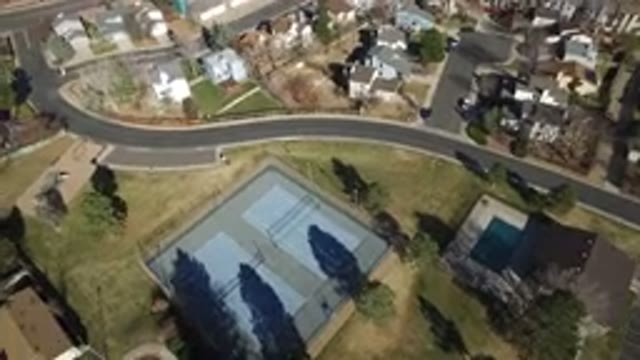HIDDEN LAKE COLORADO-2016: A Winding Road Runs Through A Neighborhood With Tennis Courts And A Swimming Pool