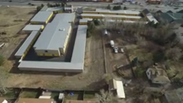 WESTMINSTER COLORADO-2016: A Simple Drone View Of A Gray Factory Beside A Busy Street