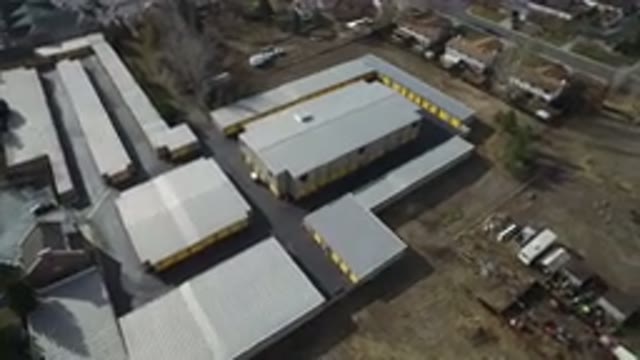WESTMINSTER COLORADO-2016: Drone Video Of Yellow Warehouse As The Camera Slowly Pans