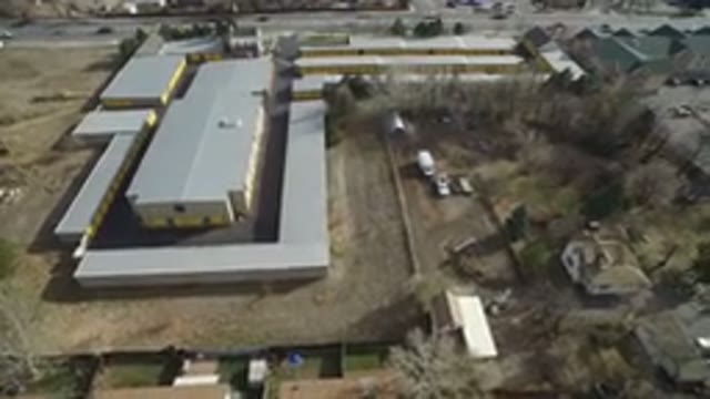 WESTMINSTER COLORADO-2016: Aerial View Of Yellow Building On A Busy Street And