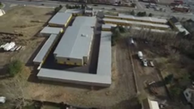 WESTMINSTER COLORADO-2016: Air Footage Of A Factory Like Building Next To A Road