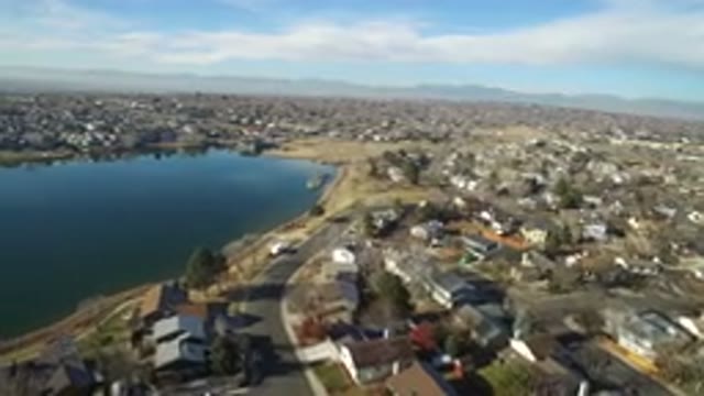 HIDDEN LAKE COLORADO-2016: Aerial View Of A City With Houses And Streets By The
