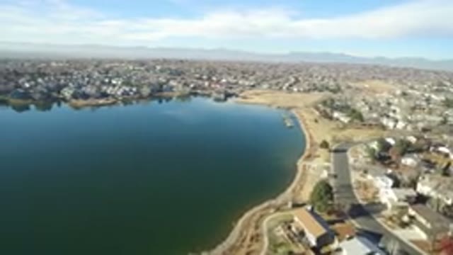 HIDDEN LAKE COLORADO-2016: Aerial Camera Overlooking Lake Near City Buildings