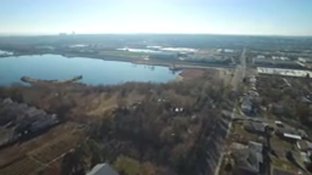 HIDDEN LAKE COLORADO-2016: Aerial View Of A City With Many Trees Next To A Lake