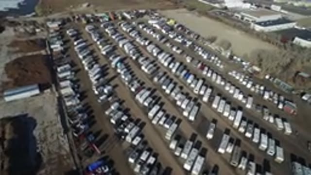 HIDDEN LAKE COLORADO-2016: A Parking Lot Full Of Trailers Trucks And Cars With A