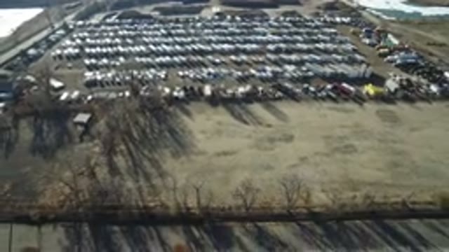 HIDDEN LAKE COLORADO-2016: View Of Numerous Cars Neatly Parked In A Large Piece Of