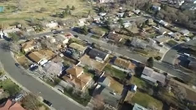HIDDEN LAKE COLORADO-2016: Aerial View Of A City With Houses Trees And A Field