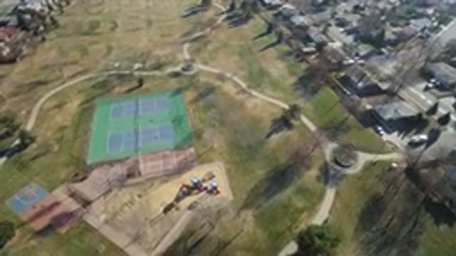 HIDDEN LAKE COLORADO-2016: Open Field With Tennis Court And Two People Playing