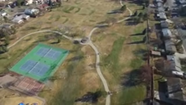 HIDDEN LAKE COLORADO-2016: Tennis Court Area On A Wide Field With Houses All