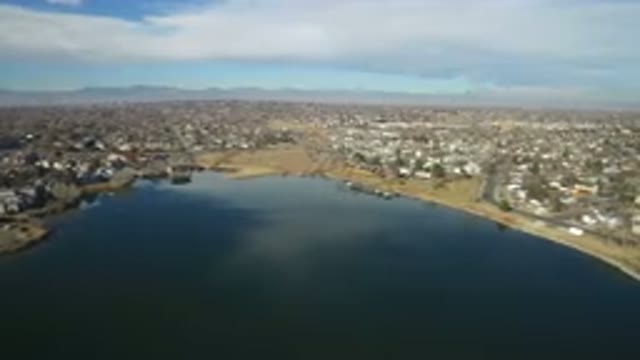 HIDDEN LAKE COLORADO-2016: Camera Moves Over Calm Lake Looking Over Desert And