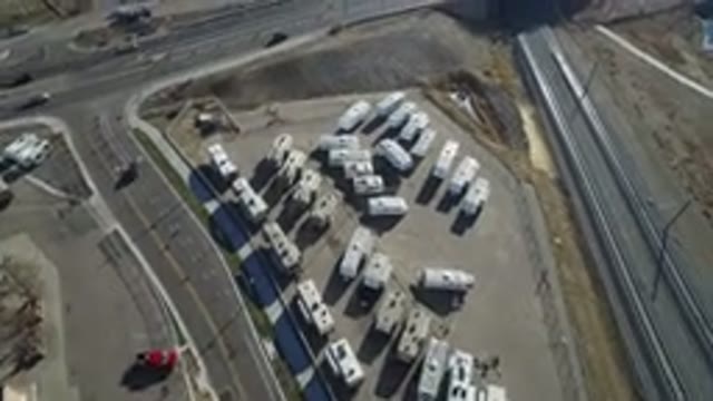 HIDDEN LAKE COLORADO-2016: Trucks Parked Aside Vehicles Moving on Road
