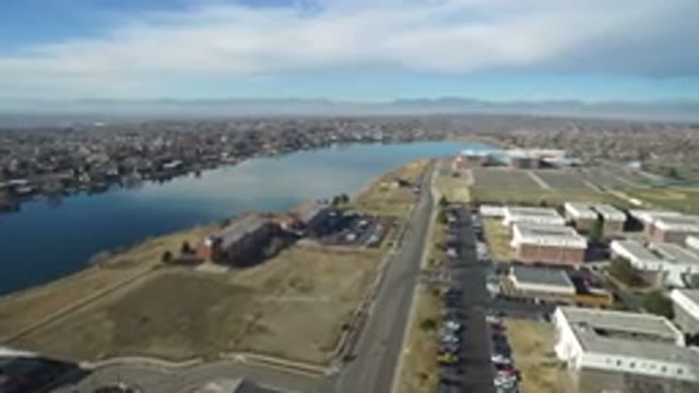 HIDDEN LAKE COLORADO-2016: Blue Sky Flyover Large Lake Many Industrial Buildings