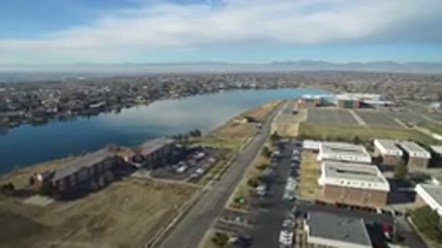 HIDDEN LAKE COLORADO-2016: Panning Aerial Shot Of Buildings With Parking Lots
