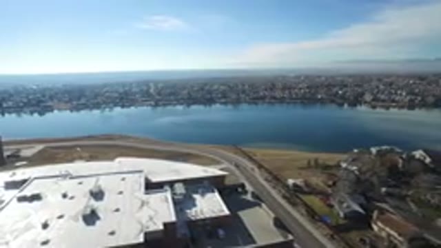 HIDDEN LAKE COLORADO-2016: Helicopter Or Airplane Flying Over A Town And Next To