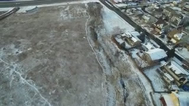 HIDDEN LAKE COLORADO-2016: Overhead View Of Icy Field And Traffic On Far Road In