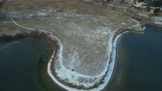 HIDDEN LAKE COLORADO-2016: Snow-Covered Areas Surrounding a Frozen Lake