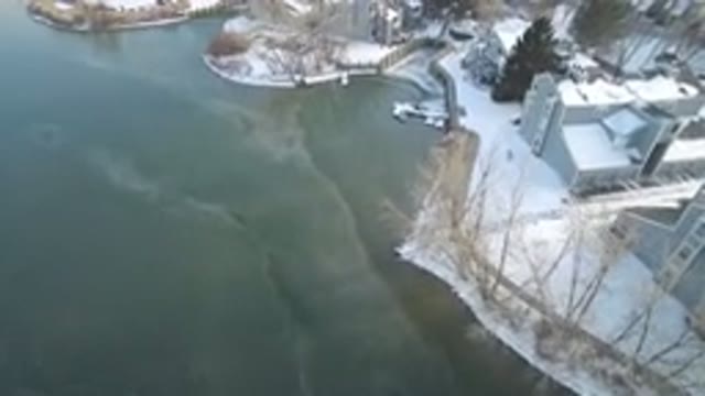 HIDDEN LAKE COLORADO-2016: Overhead Of A Snow-Covered Shoreline In Winter With