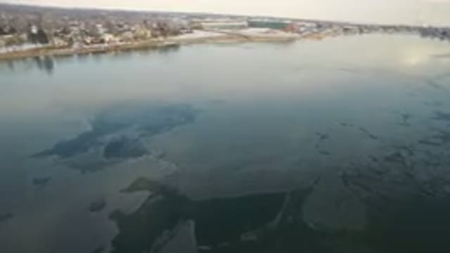 HIDDEN LAKE COLORADO-2016: Camera Slowly Panning City Coastline Sea Snowy
