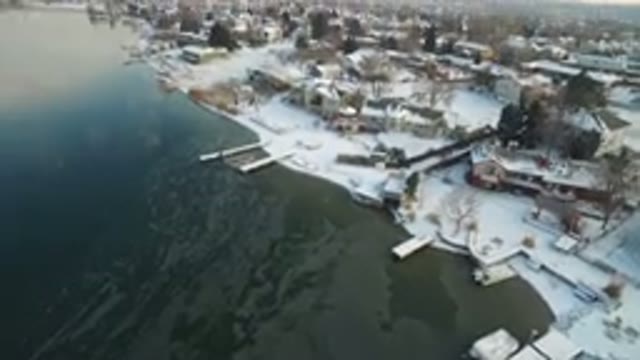 HIDDEN LAKE COLORADO-2016: Upward Panning Drone Footage Of Frozen Lake And Snow