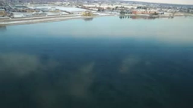HIDDEN LAKE COLORADO-2016: Drone Flies Over Lake Buildings Cars Traffic Snow