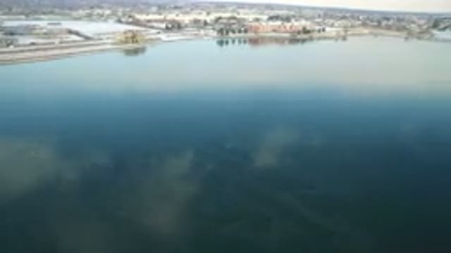 HIDDEN LAKE COLORADO-2016: Aerial View Of A Reflection Of Blue Sky In Water Of A