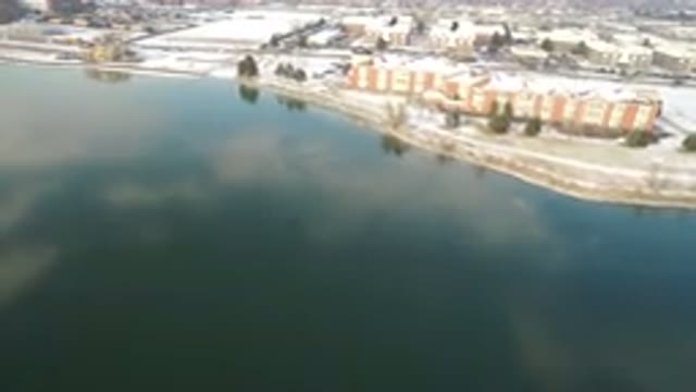 HIDDEN LAKE COLORADO-2016: Drone Footage Over Lake Near Town With Buildings