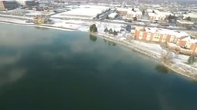 HIDDEN LAKE COLORADO-2016: Birds-Eye-View Of A Water Bank In A Snow City