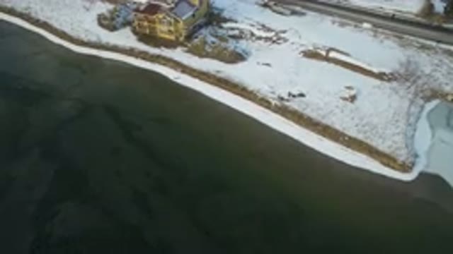 HIDDEN LAKE COLORADO-2016: Small Light-Colored House Facing The Frozen Lake