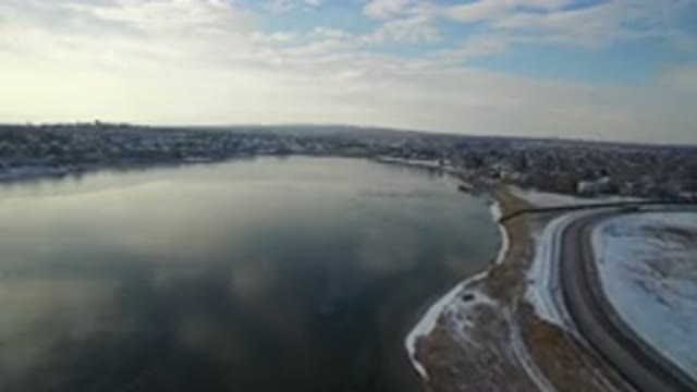HIDDEN LAKE COLORADO-2016: Flying Over A Large Frozen Lake In The Winter With