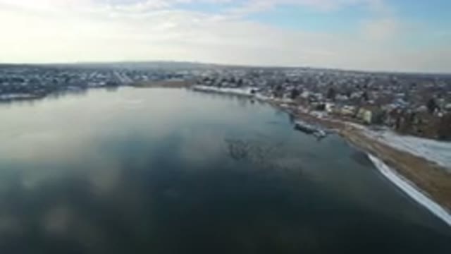 HIDDEN LAKE COLORADO-2016: An Aerial View Of A Lake With A Boat Dock And A Shore