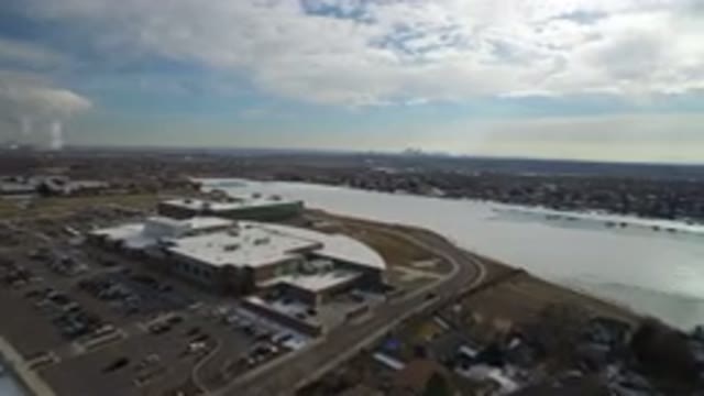 HIDDEN LAKE COLORADO-2016: Top View Of A Large Building Beside A Lake With Many