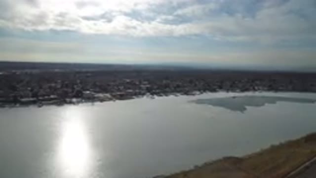HIDDEN LAKE COLORADO-2016: A Person Recording a Video Near a Lake and Buildings
