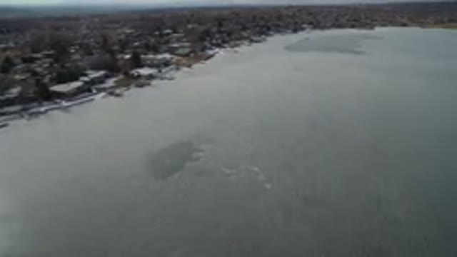 HIDDEN LAKE COLORADO-2016: Aerial Video Of Sea With A Town On The Coast On A