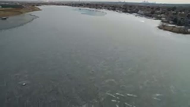 HIDDEN LAKE COLORADO-2016: Moving Drone Footage Over Frozen Lake And Surrounding Woods