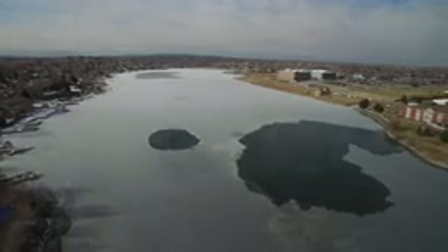HIDDEN LAKE COLORADO-2016: Aerial Footage Of A Large Body Of Water And Green