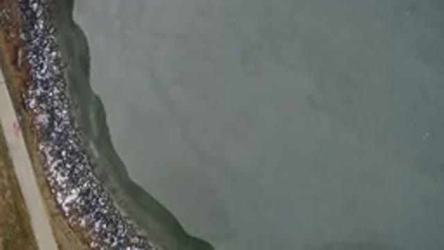 HIDDEN LAKE COLORADO-2016: Aerial Footage Of A Large Body Of Water With A Shore