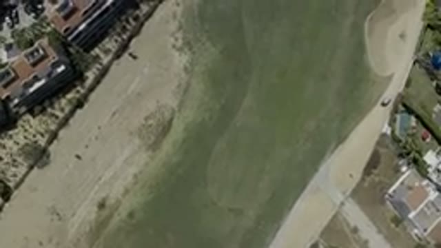 LOS CABOS MEXICO-2019: Flyover Video Of A Green Field Below On Right Are Many