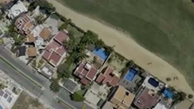 LOS CABOS MEXICO-2019: Drone Footage Over Town Buildings Streets Pools Grassy Areas