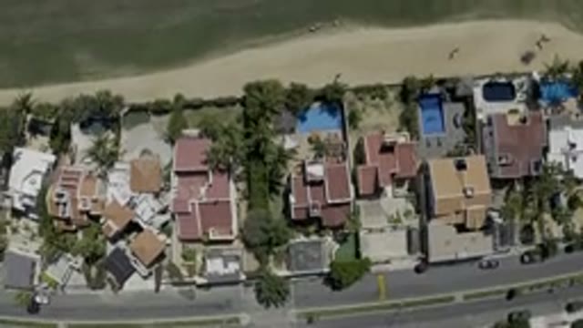 LOS CABOS MEXICO-2019: An Aerial View Of A Green Field Flanked On Both Sides By