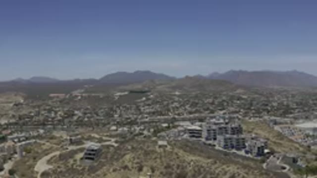 LOS CABOS MEXICO-2019: Long Distance View Of Mountains Buildings Desert Like