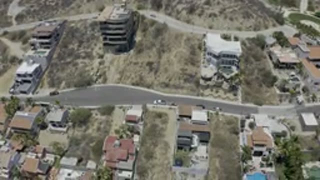 LOS CABOS MEXICO-2019: Aerial Drone View Of White Houses In Desert Landscape
