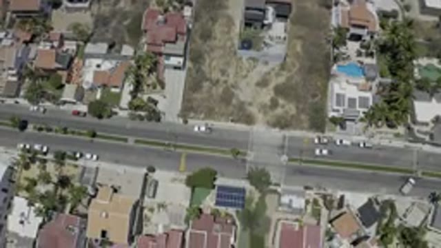LOS CABOS MEXICO-2019: Drone Footage Over Town Buildings Palm Trees Swimming Pools